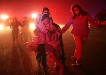 Los Angeles Mayor Karen Bass faces criticism for being out of the country